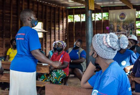 Learnmore Ndarera, leader of a Safe Space in Chimanimani women group talking to other women about the benefits of safe spaces