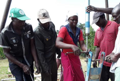 Beauty Makoto, a pump minder from Nyamaropa, Nyanga repairing a borehole
