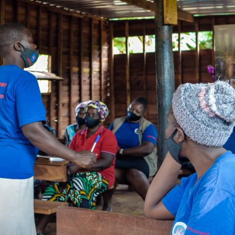 Learnmore Ndarera, leader of a Safe Space in Chimanimani women group talking to other women about the benefits of safe spaces