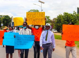 School students from Makoni and ActionAid staff campaign against child marriages during the 16 Days of Activism Against Gender Based Violence Commemorations in December 2021.